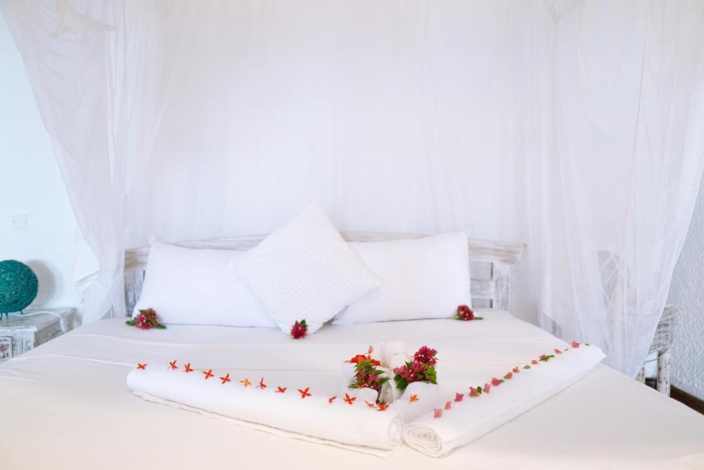Postel nebo postele na pokoji v ubytování Met Beach Resort Malindi
