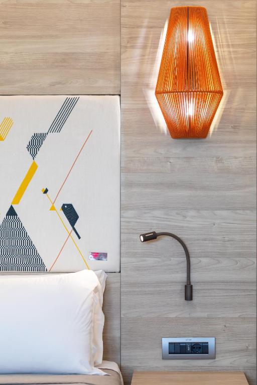 Postel nebo postele na pokoji v ubytování Lu' Hotel Carbonia