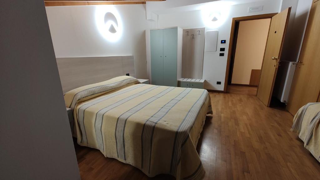 Postel nebo postele na pokoji v ubytování Wine Resort
