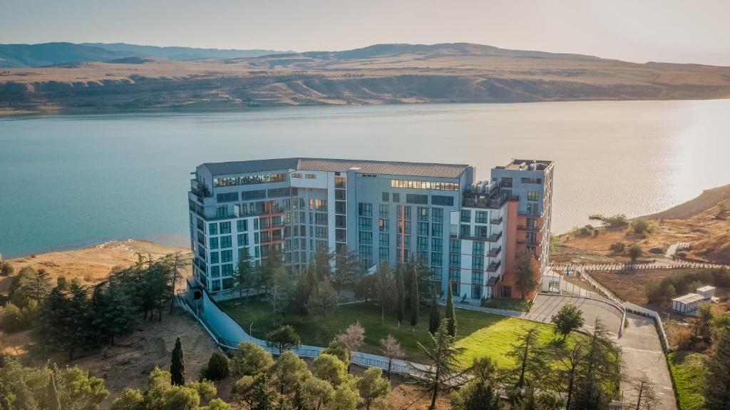 an aerial view of a building next to a body of water at Gino Seaside Tbilisi, Trademark Collection by Wyndham in Tbilisi City