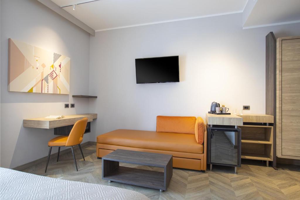 TV a/nebo společenská místnost v ubytování Lu' Hotel Carbonia