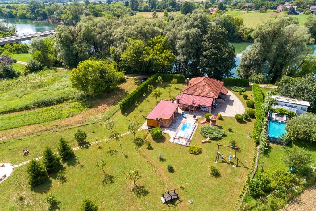an aerial view of a small house on a field at Wellness House On The River Kupa - Happy Rentals in Banska Selnica