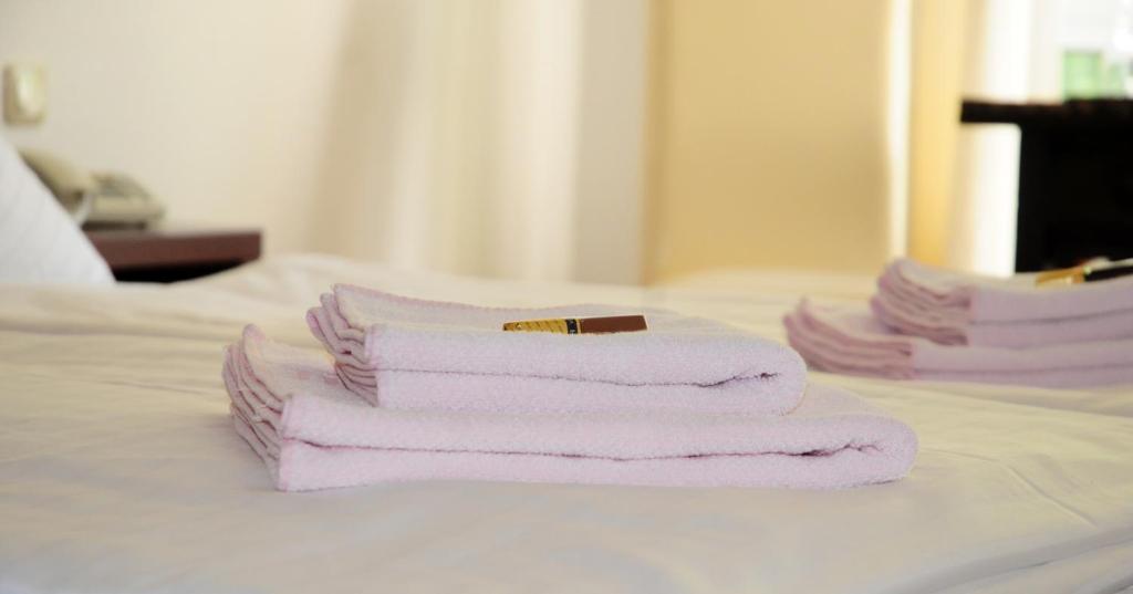 Postel nebo postele na pokoji v ubytování Hotel Blankenese