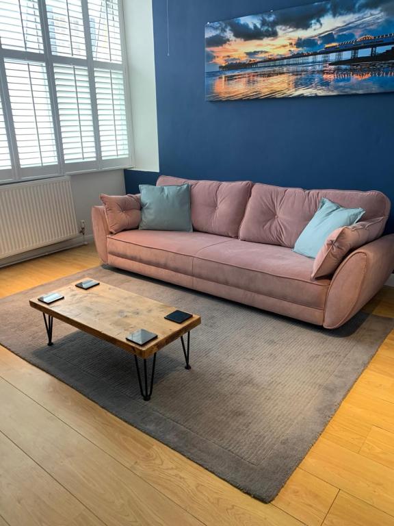 a living room with a couch and a coffee table at Beautiful Brighton Home in Brighton & Hove