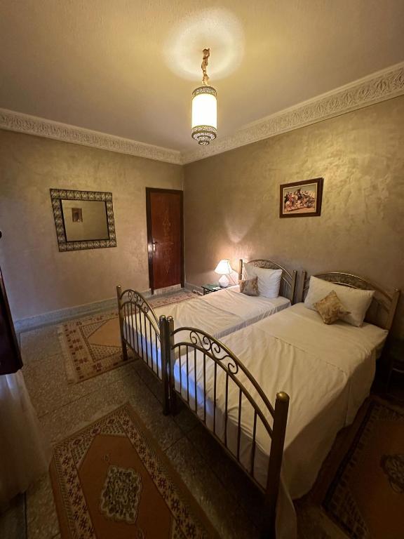 Postel nebo postele na pokoji v ubytování Riad Annada