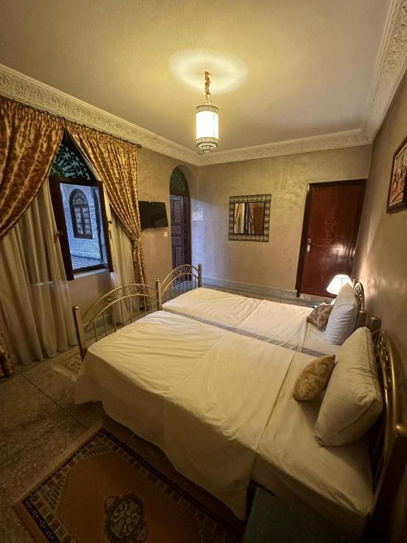 Postel nebo postele na pokoji v ubytování Riad Annada