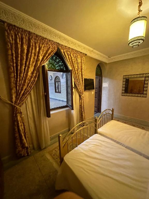 Postel nebo postele na pokoji v ubytování Riad Annada