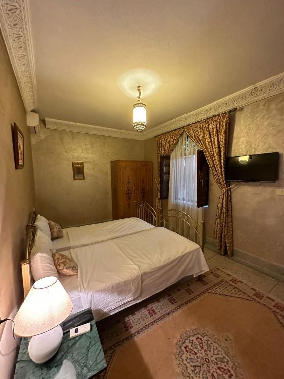 Postel nebo postele na pokoji v ubytování Riad Annada