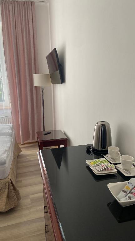 Postel nebo postele na pokoji v ubytování Aparthotel Slezák