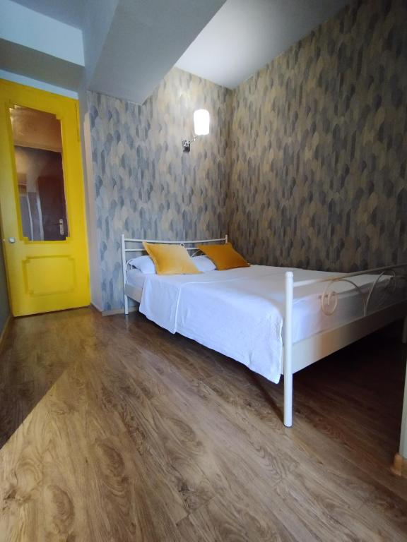Postel nebo postele na pokoji v ubytování Davka Apartments