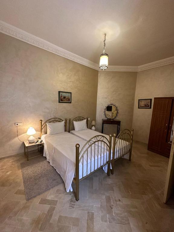 Postel nebo postele na pokoji v ubytování Riad Annada