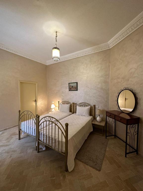 Postel nebo postele na pokoji v ubytování Riad Annada