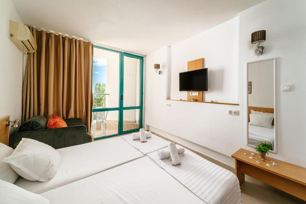 Postel nebo postele na pokoji v ubytování Hotel Delfin - All Inclusive