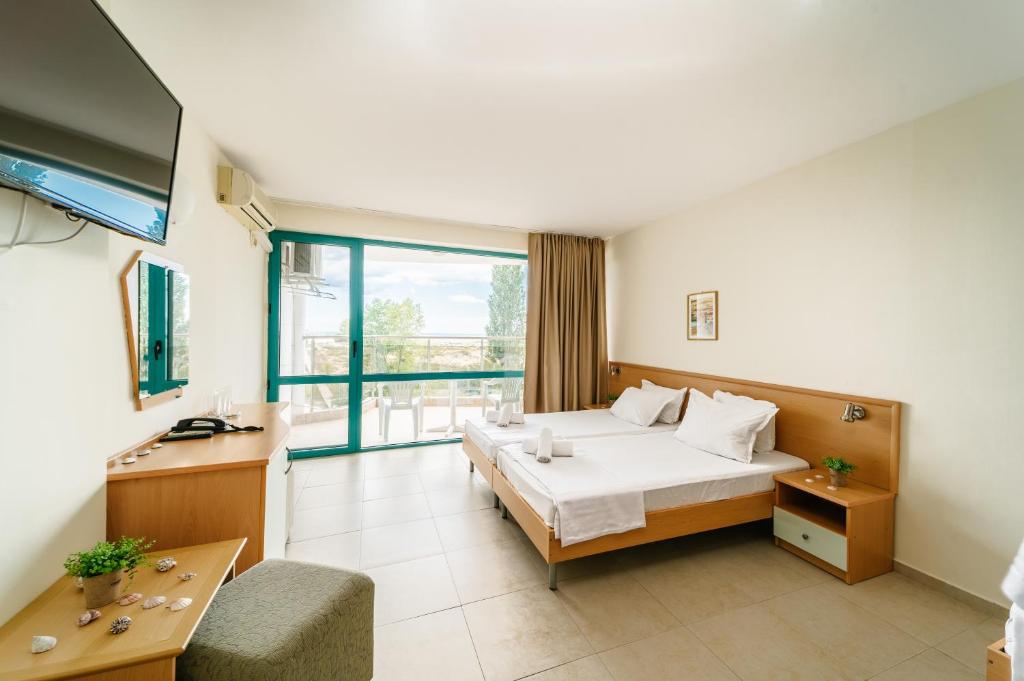 Postel nebo postele na pokoji v ubytování Hotel Delfin - All Inclusive