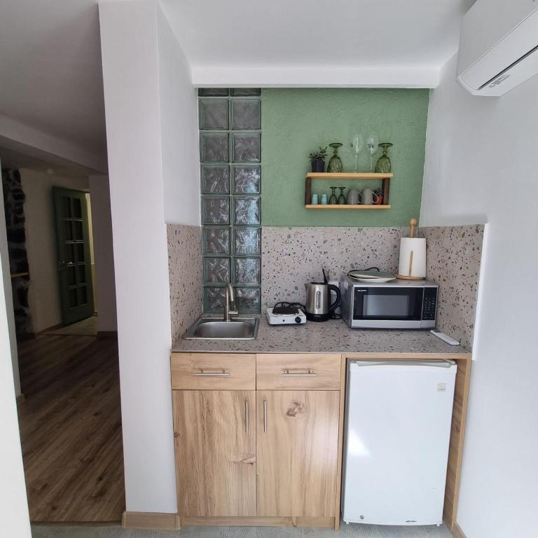 Kuchyň nebo kuchyňský kout v ubytování River House Boutique Hotel