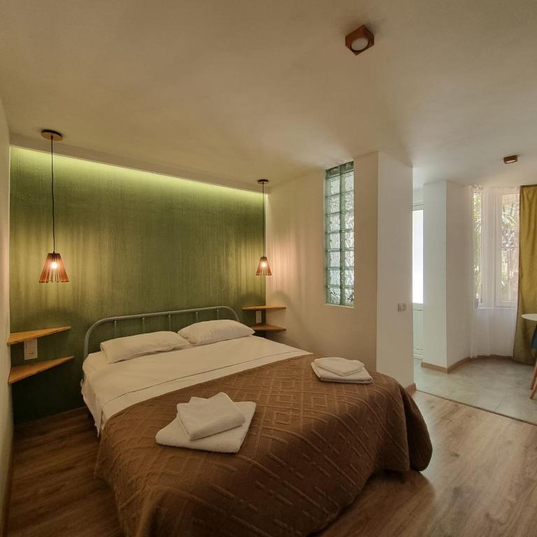 Postel nebo postele na pokoji v ubytování River House Boutique Hotel