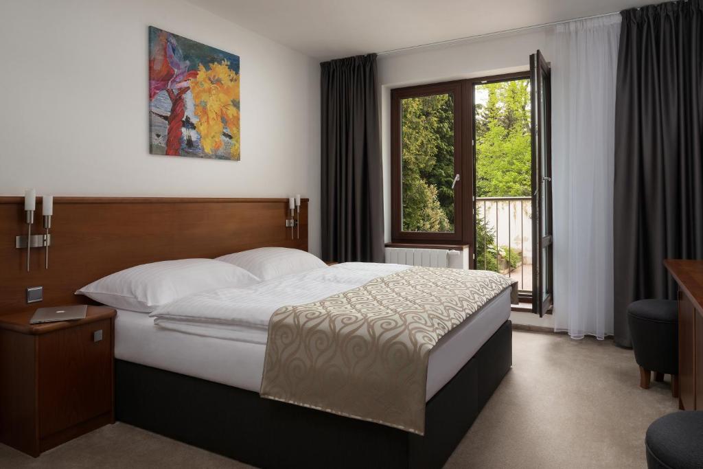 מיטה או מיטות בחדר ב-Penzion Integrity