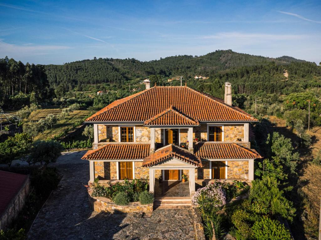 an aerial view of a house with a roof at Quinta da Palhota in Vila de Rei