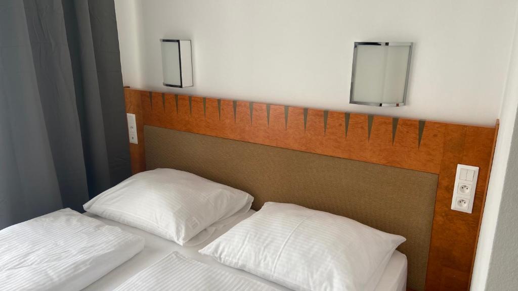 Postel nebo postele na pokoji v ubytování Aparthotel Slezák