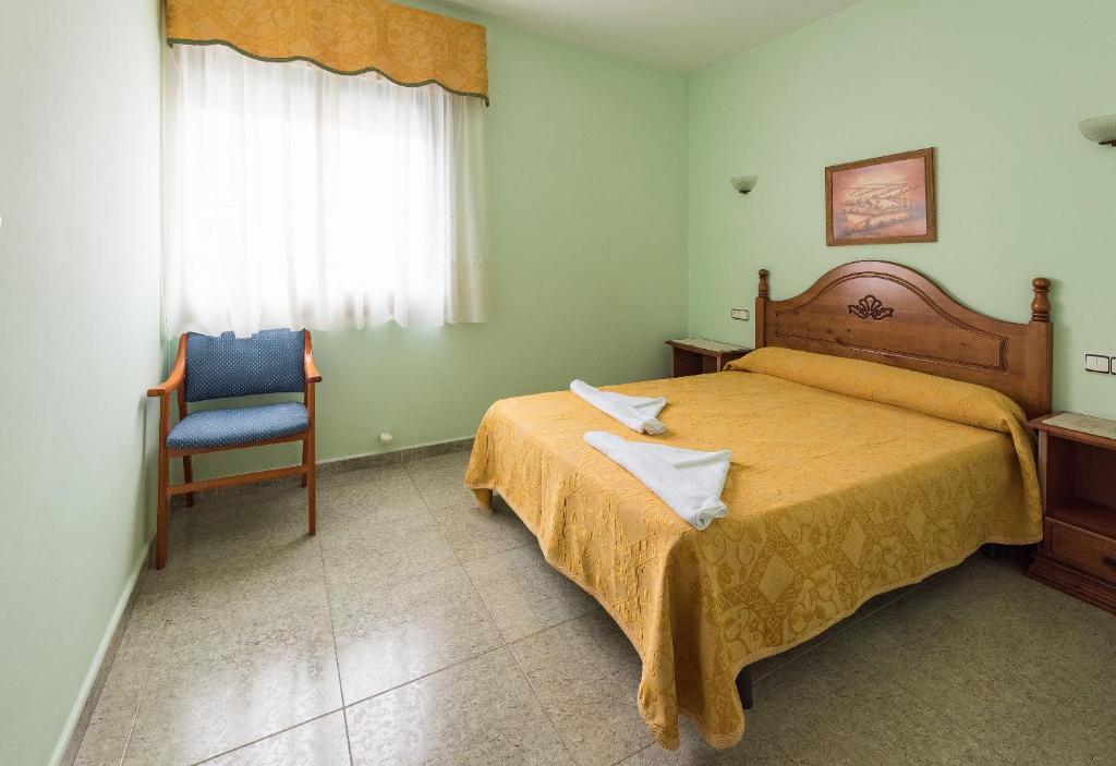 Posteľ alebo postele v izbe v ubytovaní Hostal O Camouco