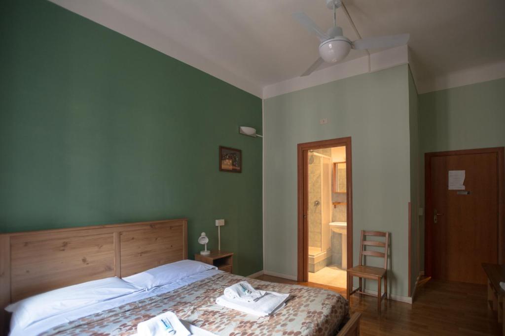Łóżko lub łóżka w pokoju w obiekcie Gialel Guesthouse