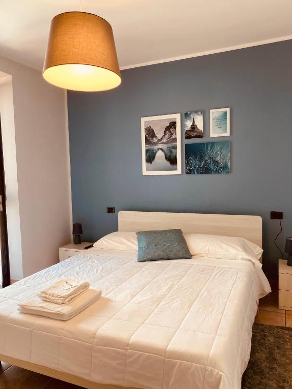 Posteľ alebo postele v izbe v ubytovaní Corte 22 B&b e Appartamenti