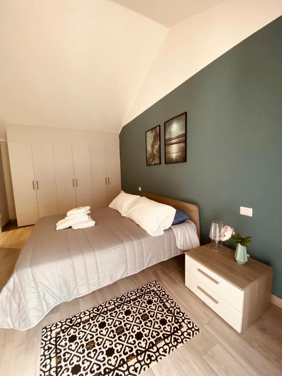 Posteľ alebo postele v izbe v ubytovaní Corte 22 B&b e Appartamenti