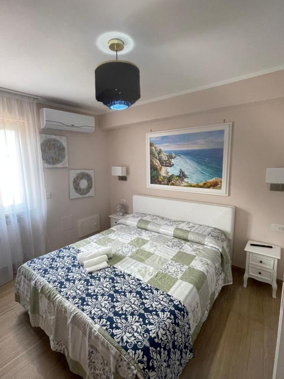 מיטה או מיטות בחדר ב-Residenza le sirene