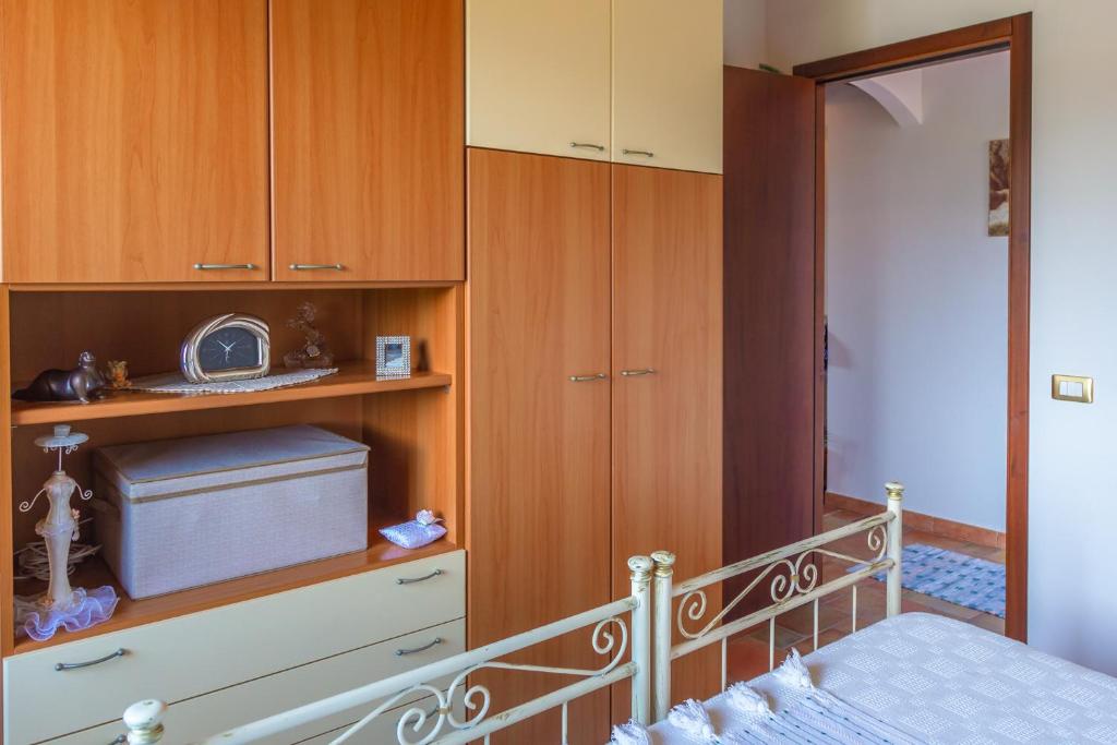 A bed or beds in a room at La Rosa Rossa