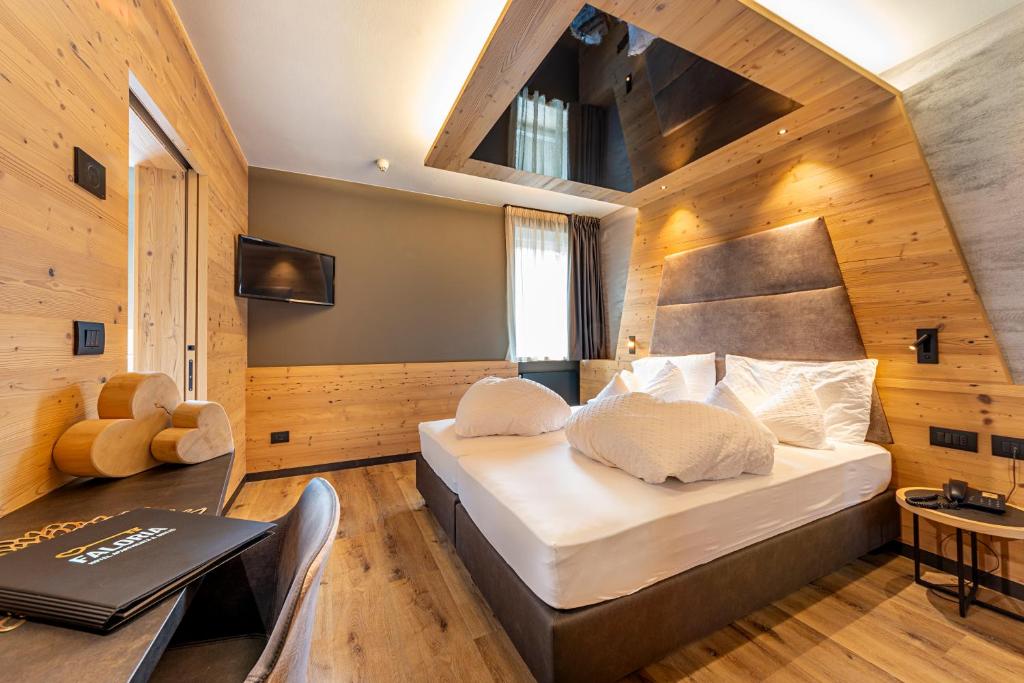 Postel nebo postele na pokoji v ubytování Hotel Faloria