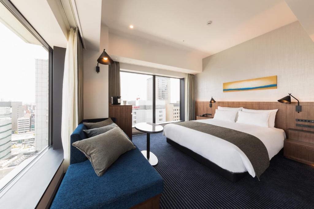Postel nebo postele na pokoji v ubytování Hotel Metropolitan Kawasaki