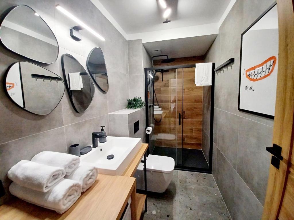 Koupelna v ubytování Kolory Warmii Apartamenty Garaż Podziemny