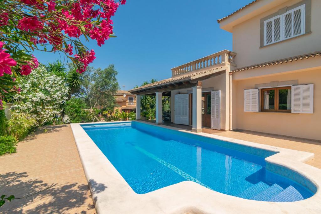 a swimming pool in the backyard of a villa at Villa Son Serra in Son Serra de Marina