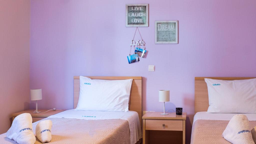 Postel nebo postele na pokoji v ubytování Vakakis-ME Apartments