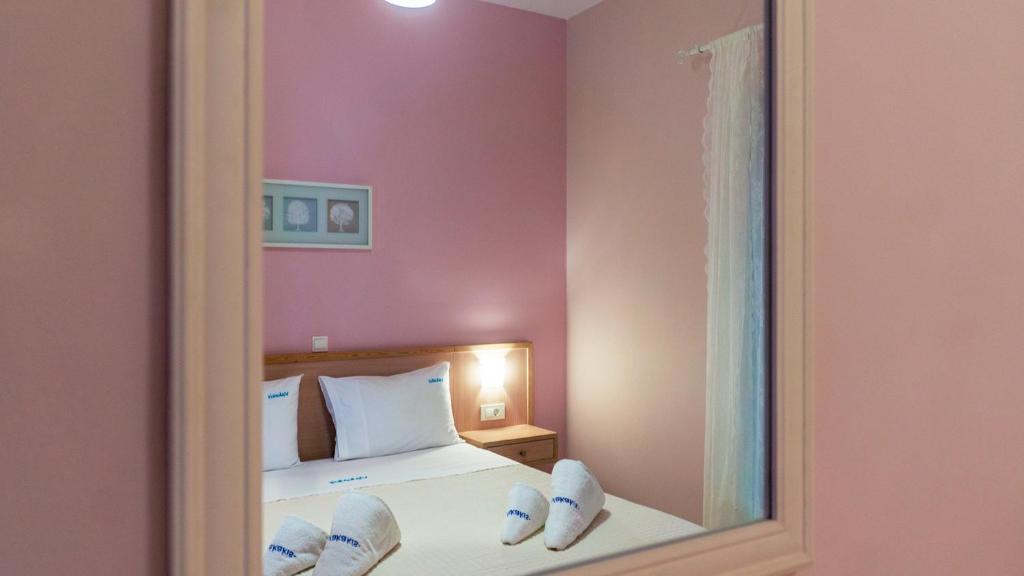 Postel nebo postele na pokoji v ubytování Vakakis-ME Apartments