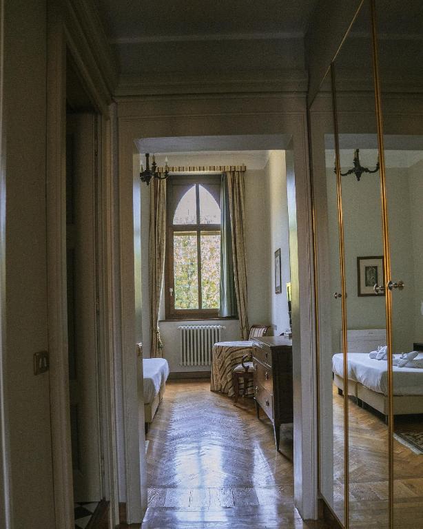 Postel nebo postele na pokoji v ubytování Il Castello Di San Gaudenzio