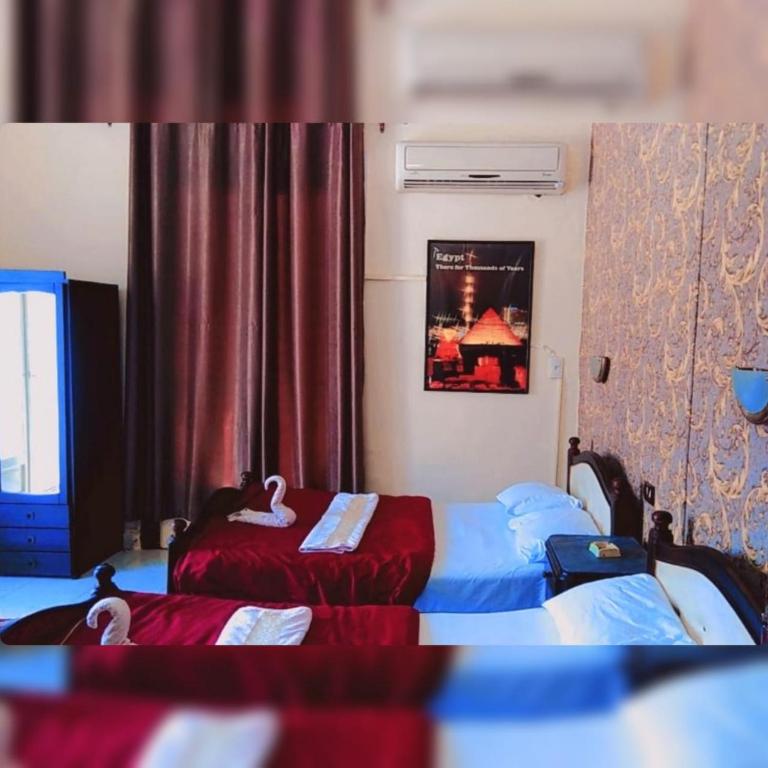 Postel nebo postele na pokoji v ubytování New Palace Hotel