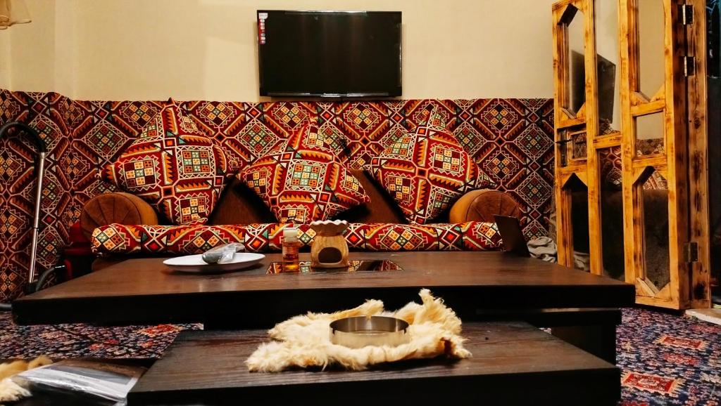 a living room with a couch and a table at Grandma's house in Wadi Musa