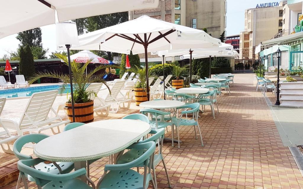 Bazén v ubytování Hotel Delfin - All Inclusive nebo v jeho okolí