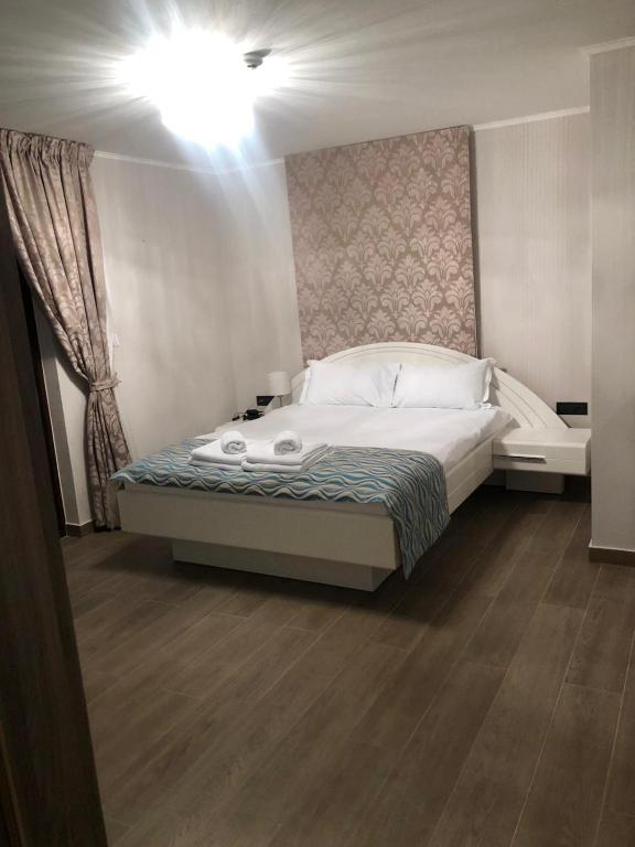 Postel nebo postele na pokoji v ubytování Hotel Petrčane