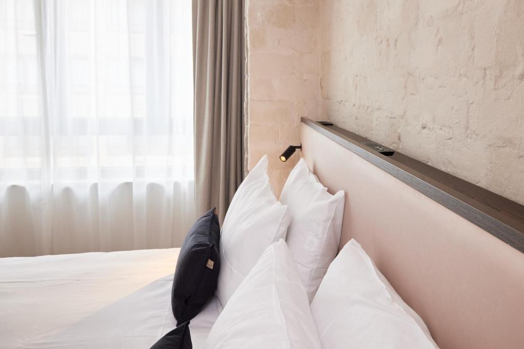 Postel nebo postele na pokoji v ubytování Rosa Hotel