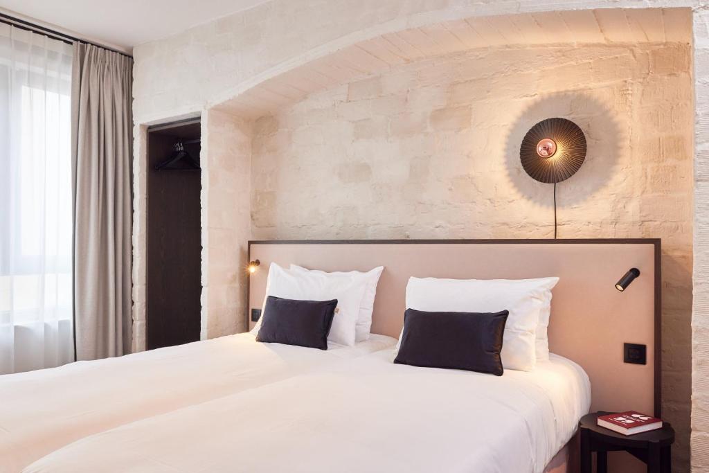 Postel nebo postele na pokoji v ubytování Rosa Hotel