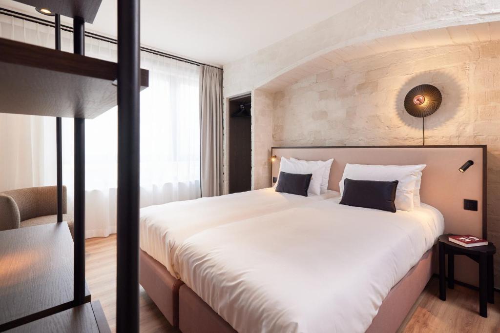 Postel nebo postele na pokoji v ubytování Rosa Hotel