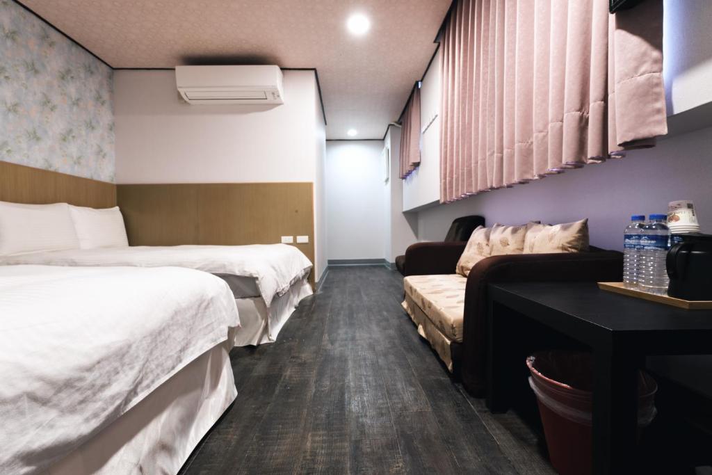 Postel nebo postele na pokoji v ubytování Sofu Hotel