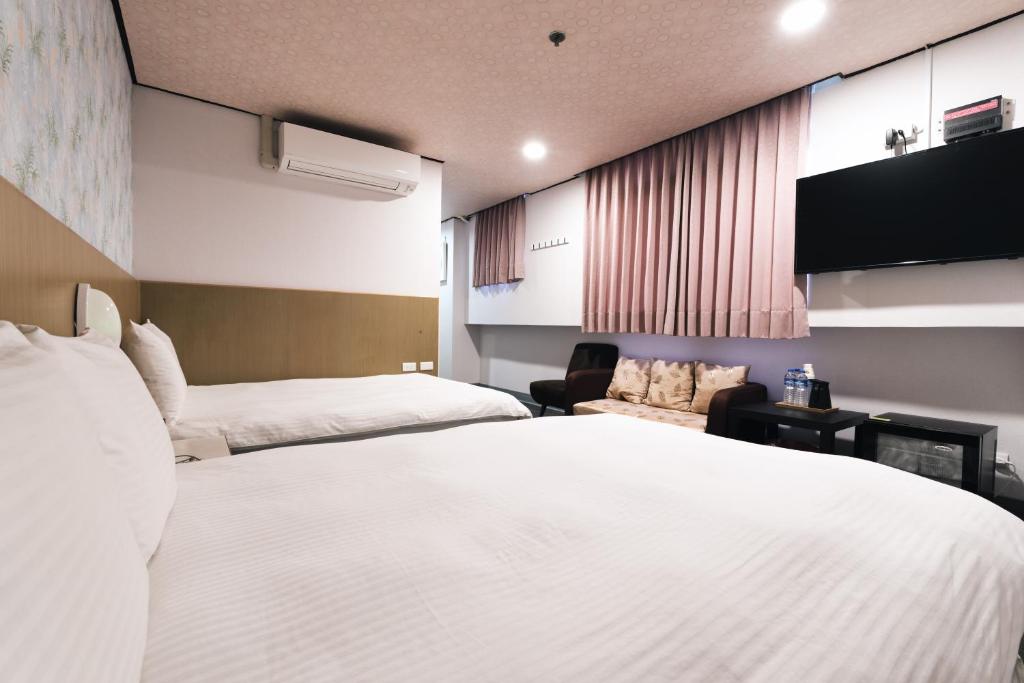 Postel nebo postele na pokoji v ubytování Sofu Hotel