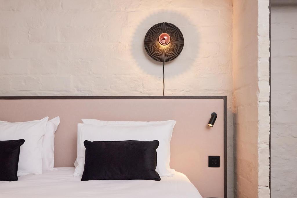 Postel nebo postele na pokoji v ubytování Rosa Hotel