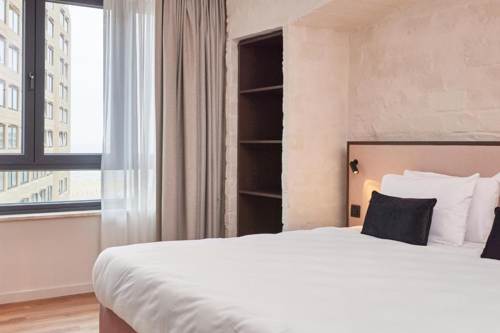 Postel nebo postele na pokoji v ubytování Rosa Hotel