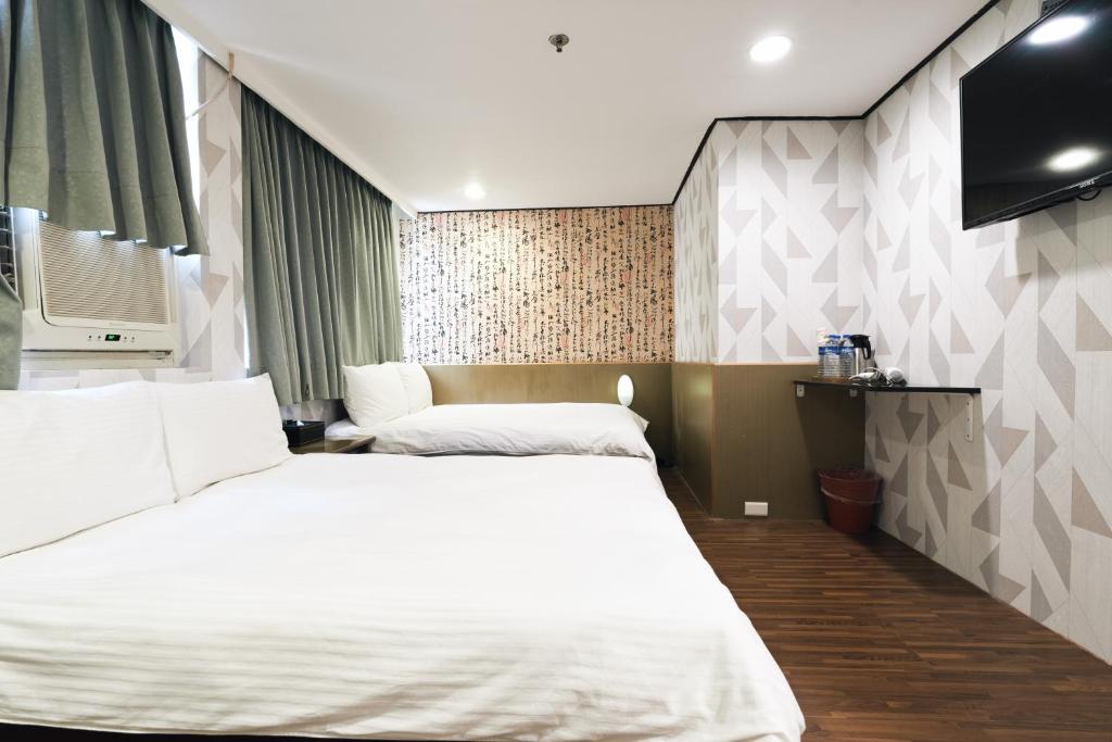 Postel nebo postele na pokoji v ubytování Sofu Hotel