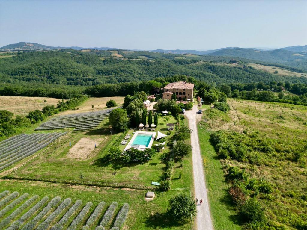 an aerial view of a farm with a swimming pool at Locanda Cugnanello in Anqua