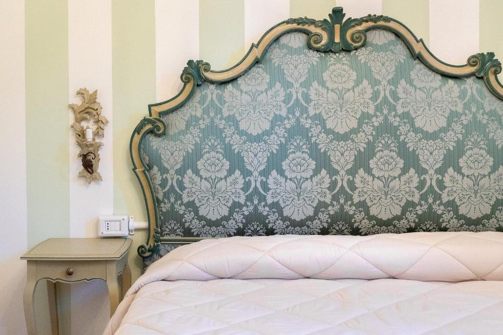 Postel nebo postele na pokoji v ubytování Hotel Rifugio la Foresta